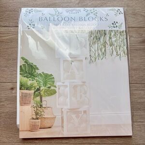 White baby balloon blocks with balloons